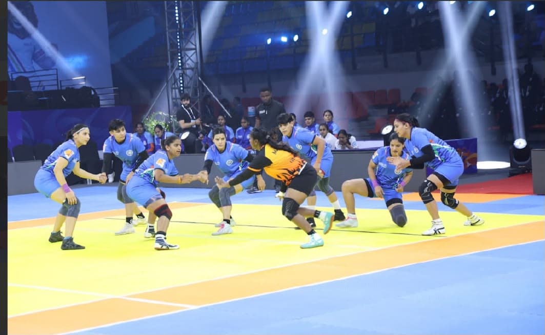 India's women's defence lines up against a Malaysia raider in Ahmedabad
