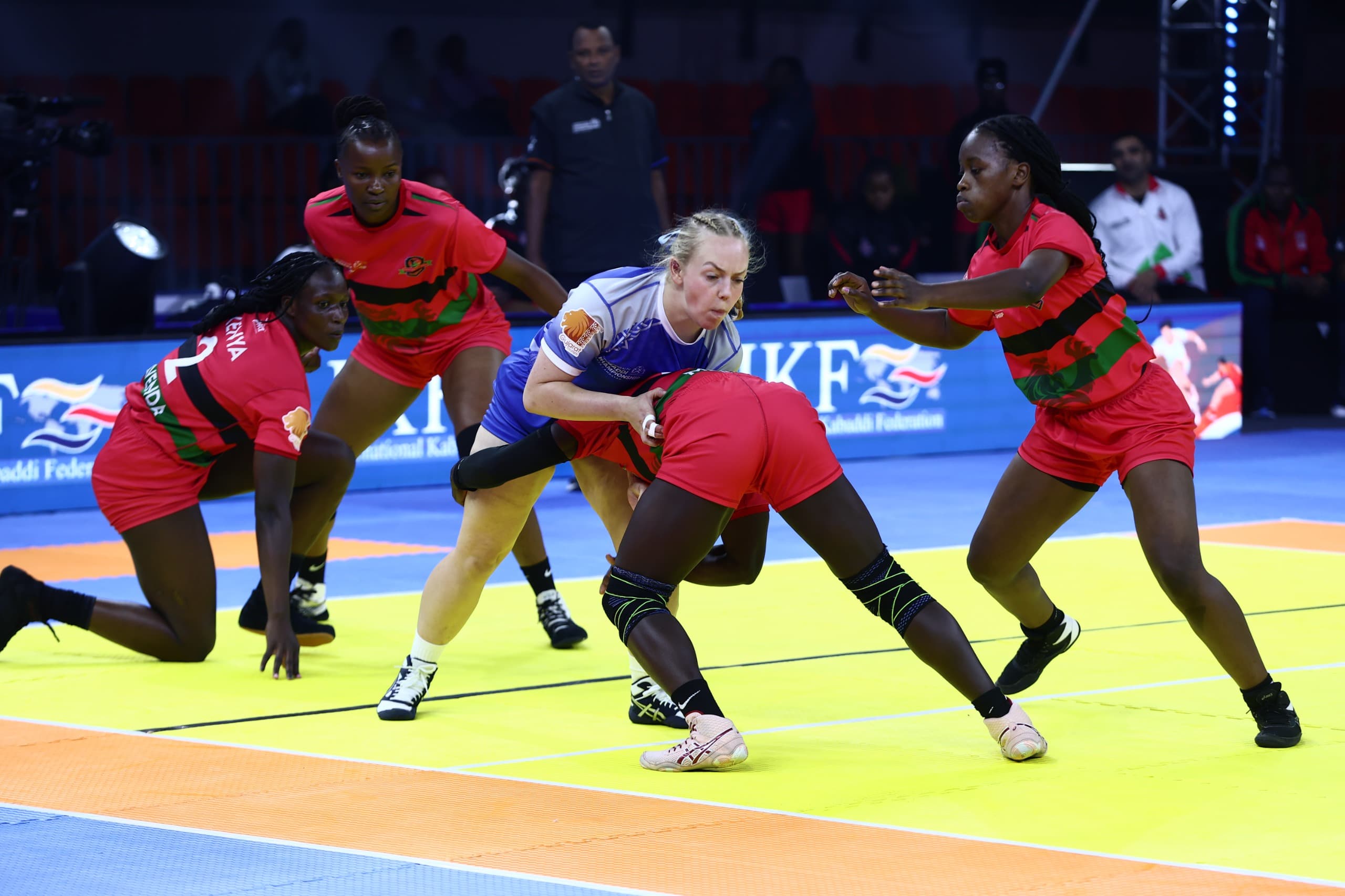 Kenya's defenders close in on a Scotland raider at the Commonwealth Kabaddi Championship