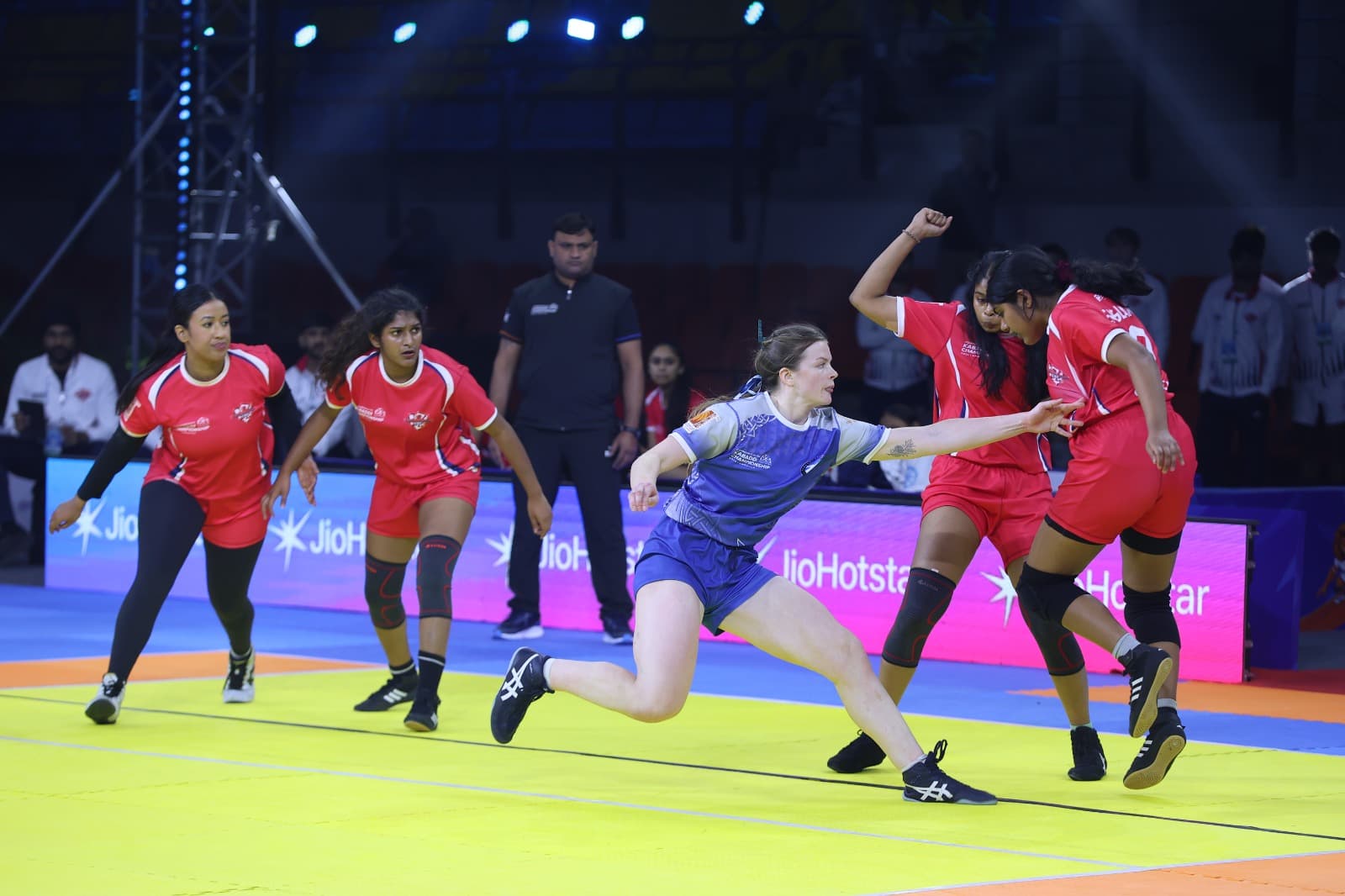 A Scotland raider reaches for a touch against England's women