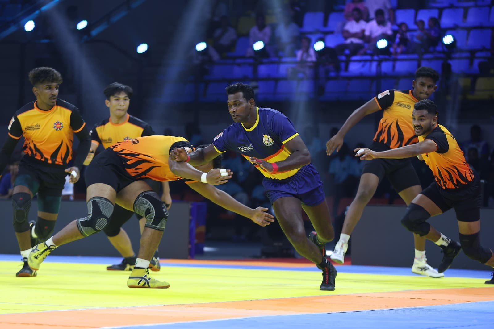 A Sri Lanka raider escapes the Malaysia defence in Ahmedabad