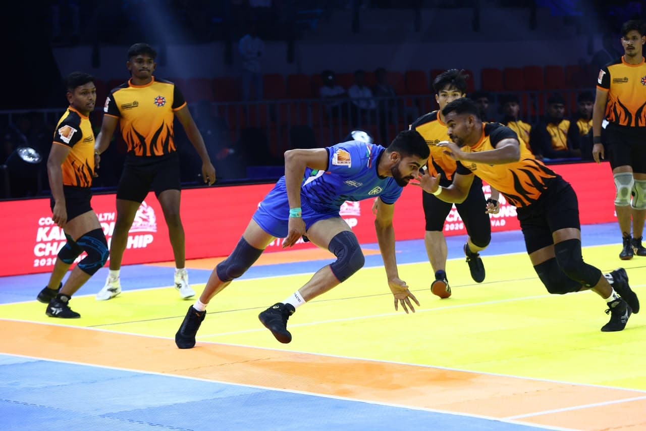 An India raider escapes the Malaysia defence at the Commonwealth Kabaddi Championship