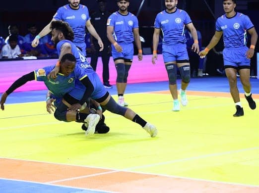India's defence brings down a Tanzania raider at the Commonwealth Kabaddi Championship
