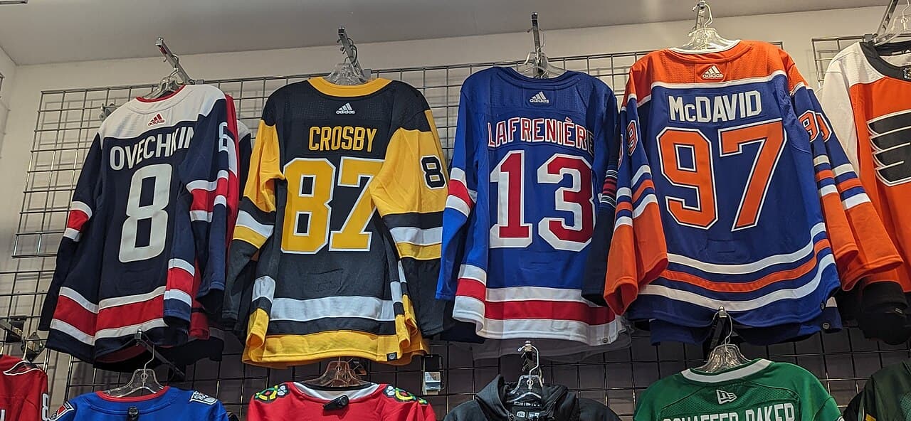 Ovechkin, Crosby, Lafrenière, and McDavid jerseys for sale in an Edmonton store (Capitals. Penguins, Rangers, and Oilers)