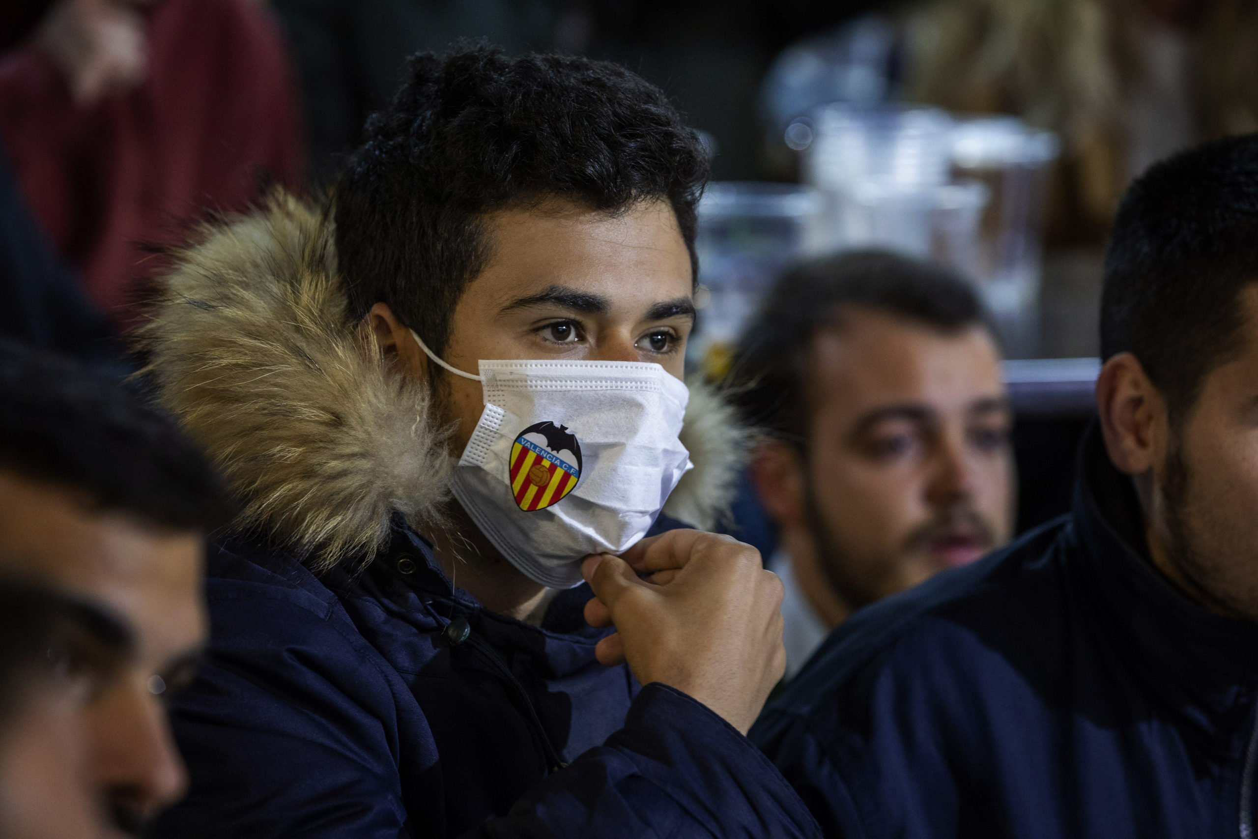 fan-with-mask-watching-a-match