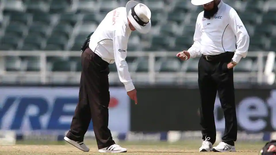 Umpires to wear gloves and not take bowlers hat when the cricket returns